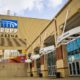 Side view of the front entrance of Rupp Arena sunny sky with clouds in background