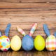 happy easter eggs on wooden table