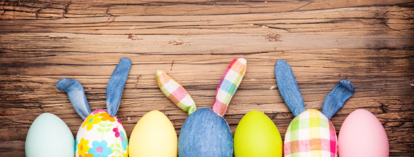 happy easter eggs on wooden table