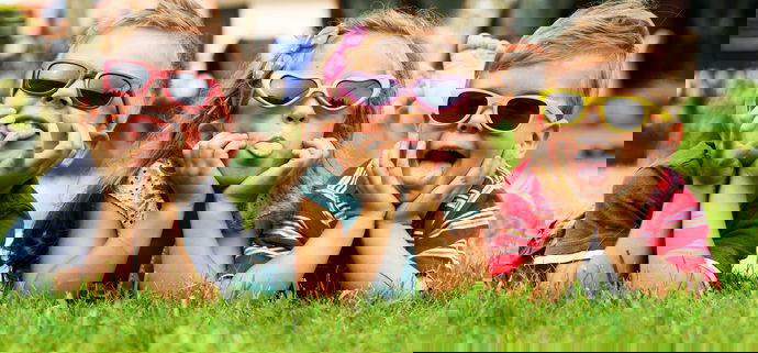 Trio children showing their tongues